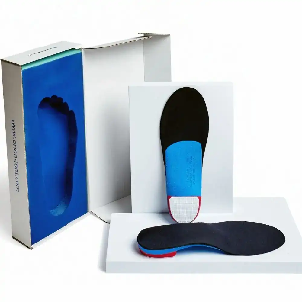 Custom insoles with pressed foot impression inside foam box for flat feet